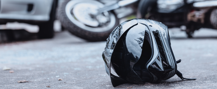 Motorcycle and motorcycle helmet on the floor after a collision