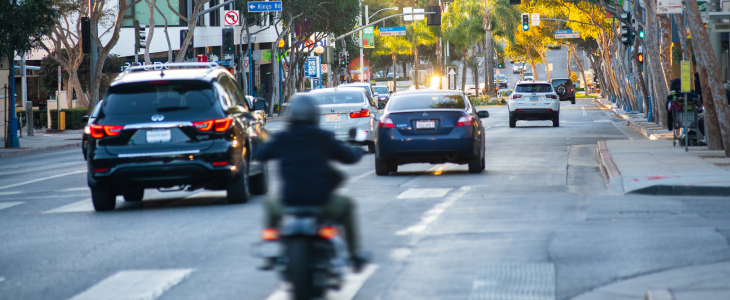 Santa Monica Boulevard with cars and shops running down WeHo, Southern California.